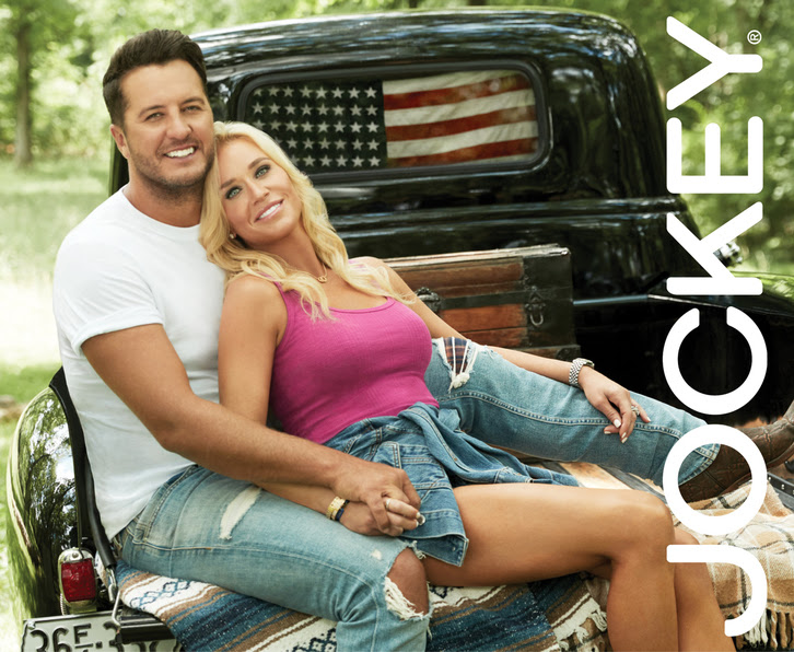 Luke and Caroline Bryan with Jockey logo in back of truck